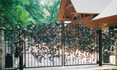 driveway gate with vines and leaves